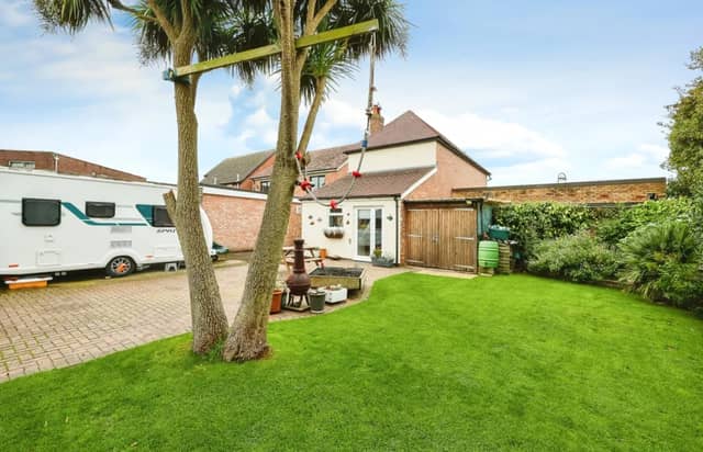 The listing says: "Morris Dibben are delighted to present to the market a superb and rare opportunity to purchase a three bedroom detached house with a commercial shop included in the sale."