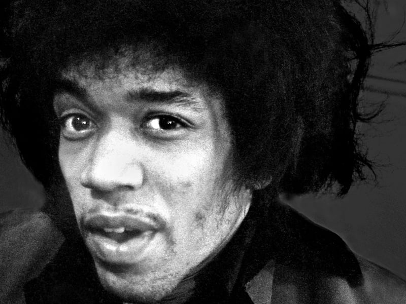 A striking portrait of rock legend Jimi Hendrix. This black & white image was taken just before Hendrix appeared on stage during a 1967 concert in Yorkshire.