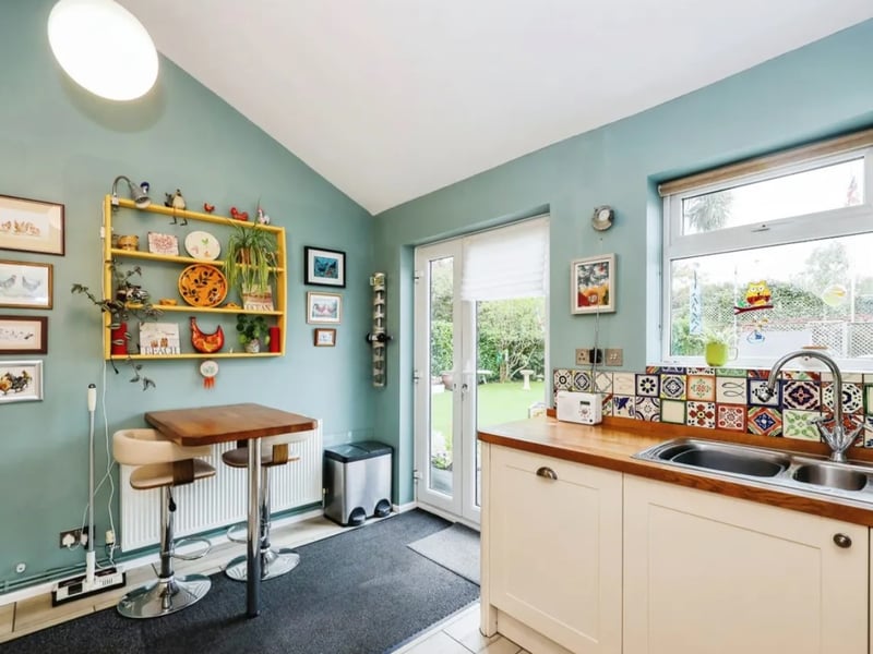 The listing says: "Desirably situated within West Town village offering convenient access to Hayling Island's beachfront, local shops and the popular golf course." 
