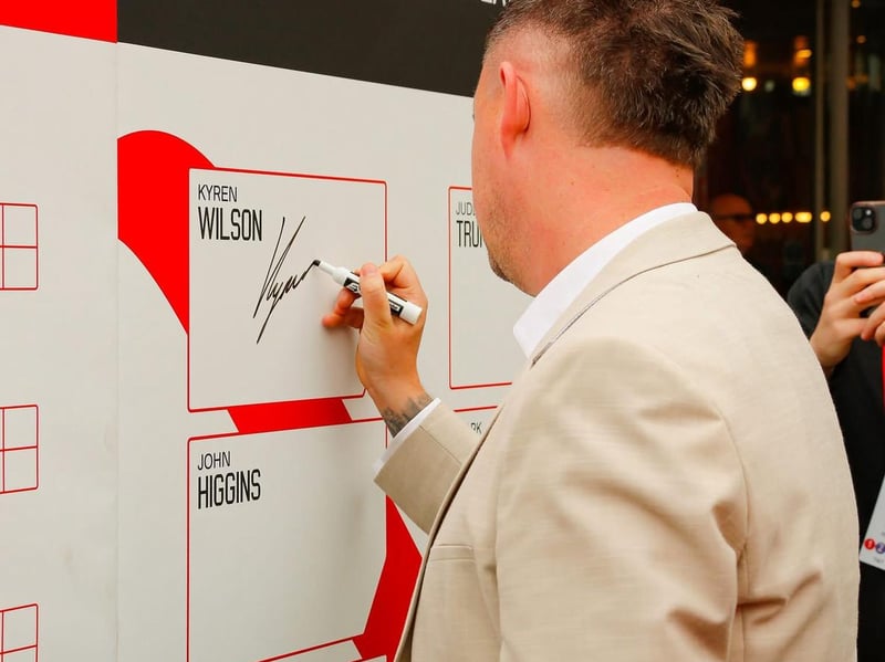 Kyren Wilson Wilson signs the board at the launch of the snooke world championships at The Crucible. Photo: Errol Edwards, Black Tie Photography