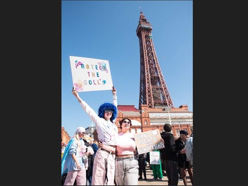 Towering support - proteters during the pro-trans rally on Blackpool's Comedy Carpet