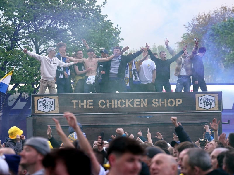 Leeds United fans celebrate promotion to the Premier League outside Elland Road.