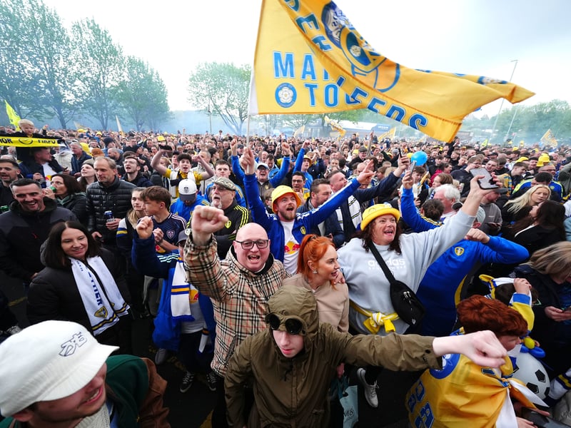 Leeds United fans celebrate promotion to the Premier League outside Elland Road.