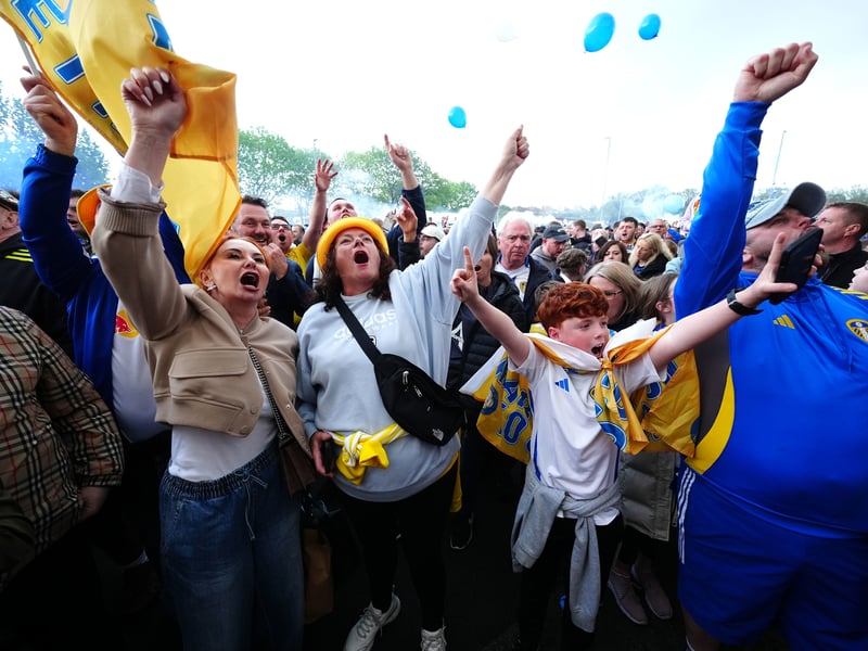 Thousands of happy fans celebrate.