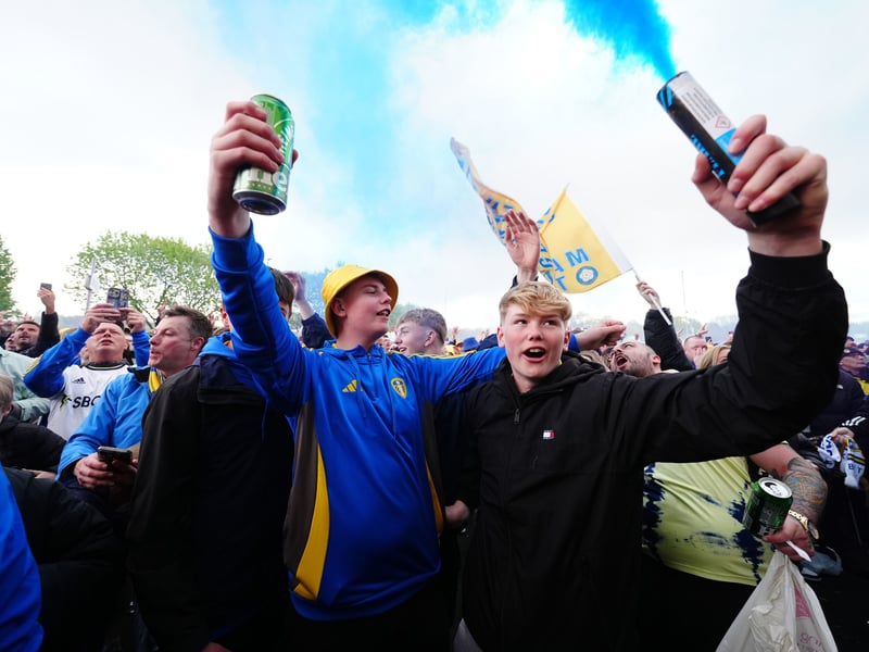 Leeds United fans celebrate promotion to the Premier League outside Elland Road.