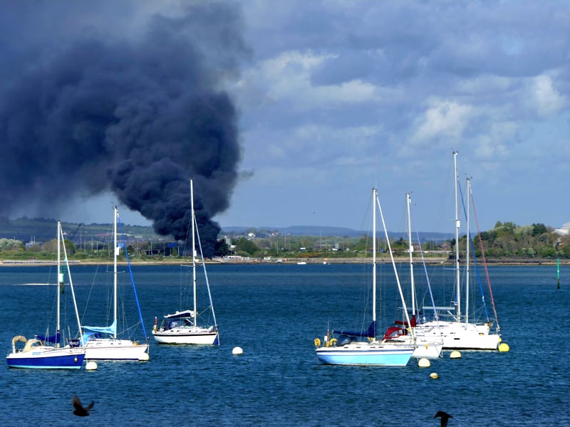 Thick plume of smoke visible across the water from Gosport