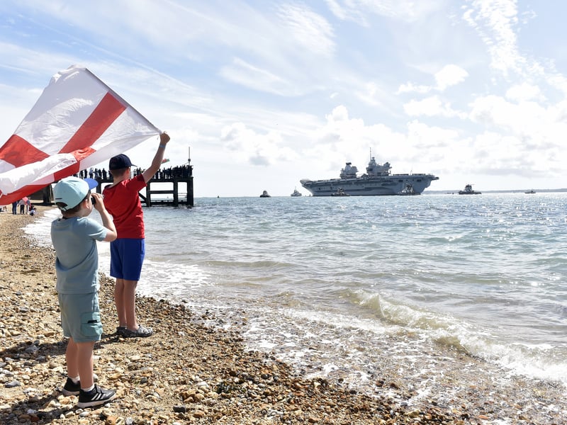 Large crowds gathered along the Hot Walls in Old Portsmouth to watch HMS Prince of Wales leave the city for a major Royal Navy Carrier Strike Group deployment to the Indo-Pacific on Tuesday, April 22 2025.