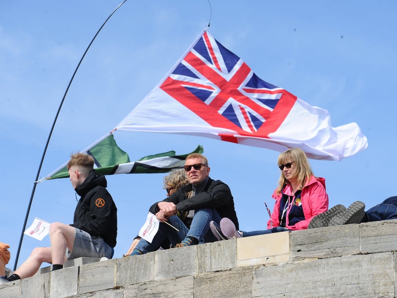 Large crowds gathered along the Hot Walls in Old Portsmouth to watch HMS Prince of Wales leave the city for a major Royal Navy Carrier Strike Group deployment to the Indo-Pacific on Tuesday, April 22 2025.
