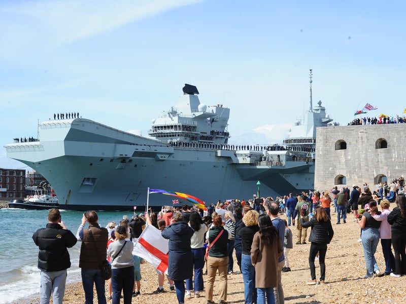 Large crowds gathered along the Hot Walls in Old Portsmouth to watch HMS Prince of Wales leave the city for a major Royal Navy Carrier Strike Group deployment to the Indo-Pacific on Tuesday, April 22 2025.