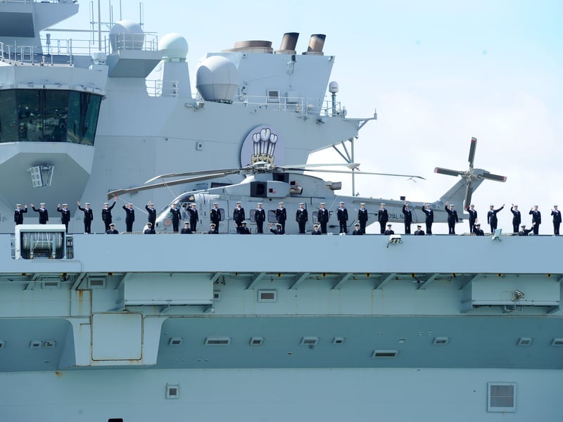 Large crowds gathered along the Hot Walls in Old Portsmouth to watch HMS Prince of Wales leave the city for a major Royal Navy Carrier Strike Group deployment to the Indo-Pacific on Tuesday, April 22 2025.