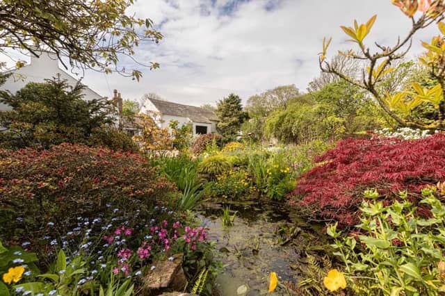 This charming three-bedroom detached house in the coastal hamlet of Blitterlees, in Cumbria, near the Lake District, is blessed with 'magnificent' mature gardens. They range from a more formal garden with a rockery and pond to a woodland meadow, an orchard and a man-made stream. There's also a five-acre paddock of arable grassland, a stone-built summerhouse and various outdoor seating areas. The property has direct access to the beach and 'gorgeous' views over Solway Firth and Criffel hill. Rose View is listed for sale with Finest Properties, for offers over £600,000.