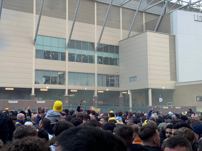 Fans wait for the players to emerge.