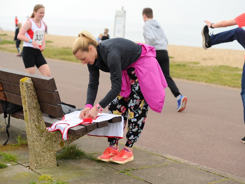 Pictured is: Jo Davis from Waterlooville, pinning her race number on her vest ready for her first Gosport Golden Mile race.
Picture: Sarah Standing (210425-4343)