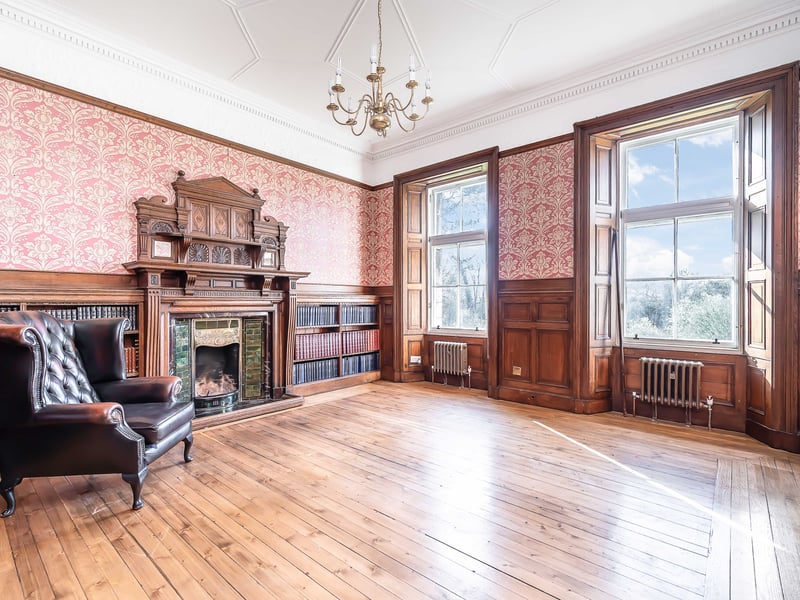 The accommodation spans two levels, with the lower ground floor housing a principal bedroom with en-suite, as well as a further bedroom