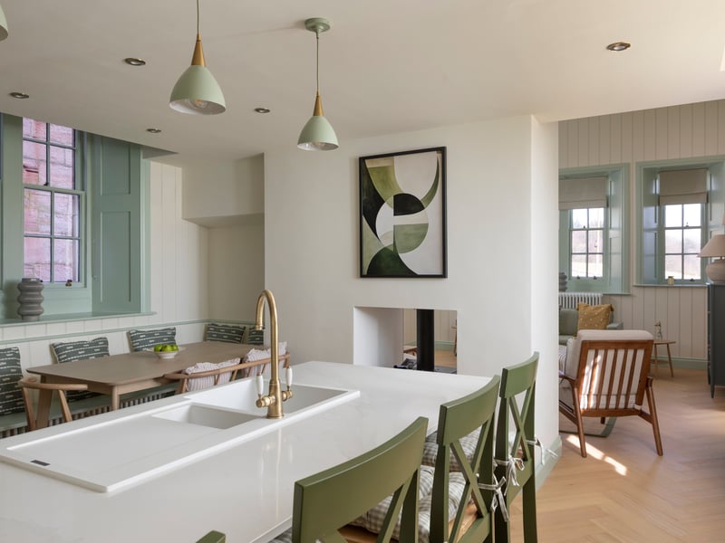 The cottage has been decorated in a fresh style with olive green and teal accents and have a modern kitchen/diner.