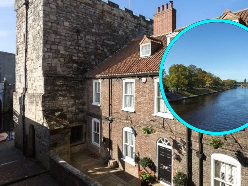 This three-bedroom house is partially constructed from York's historic city walls and boasts 'magnificent' views of the River Ouse across the rear garden.