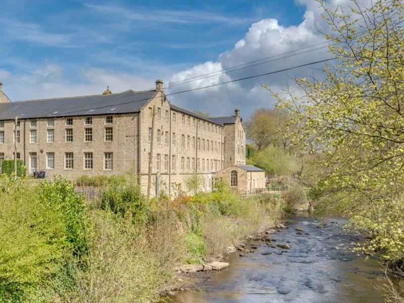 This luxury three-bedroom second floor apartment is in a Grade II-listed former mill building in the village of Glasshouses, overlooking the pretty Nidderdale countryside. It enjoys great views of the River Nidd, flowing beside the unique property.