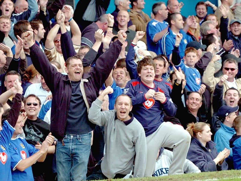 These Pompey supporters were loving the demolition of their bitter rivals.