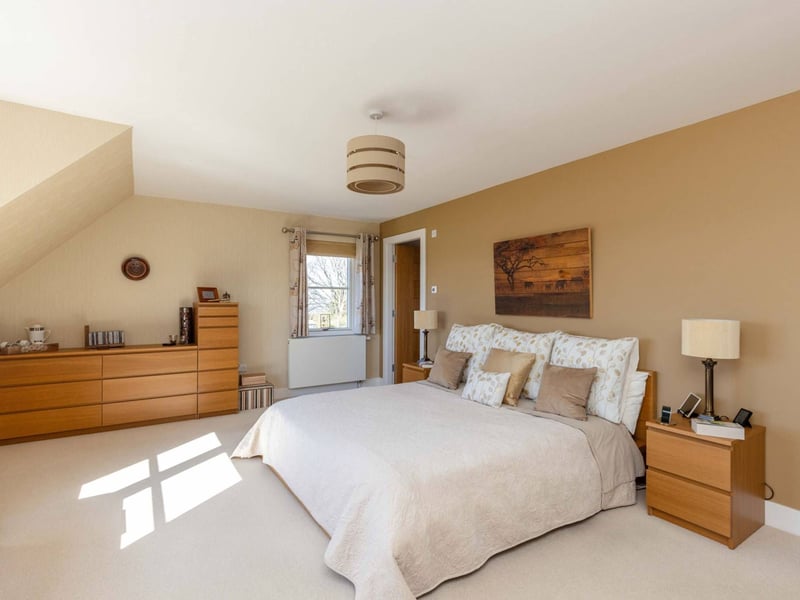 The ground floor, which has underfloor heating throughout, also includes a generous double bedroom with an en-suite shower room.