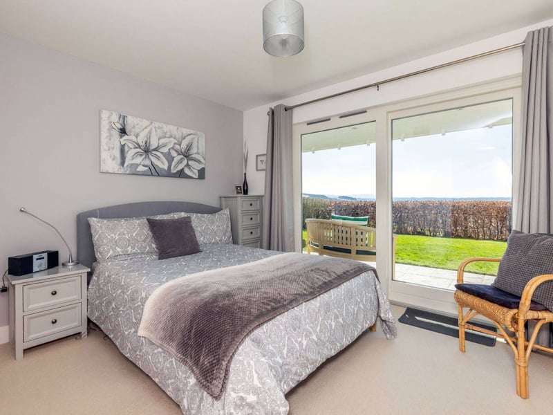The ground floor also includes this generous double bedroom with an en-suite shower room.