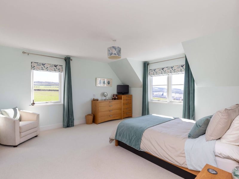 The landing upstairs gives access to three double bedrooms, two of which have en-suite shower rooms.