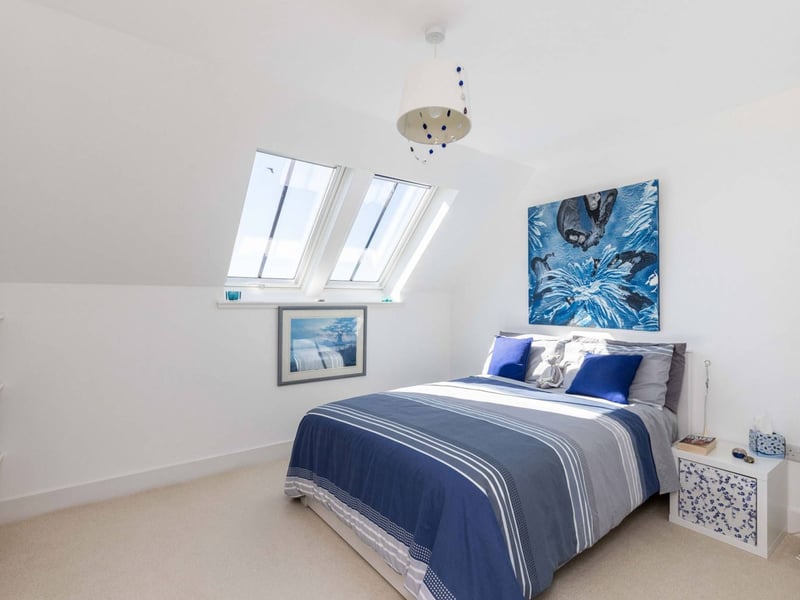 Another of the good-sized double bedrooms upstairs inside this stunning Midlothian property.