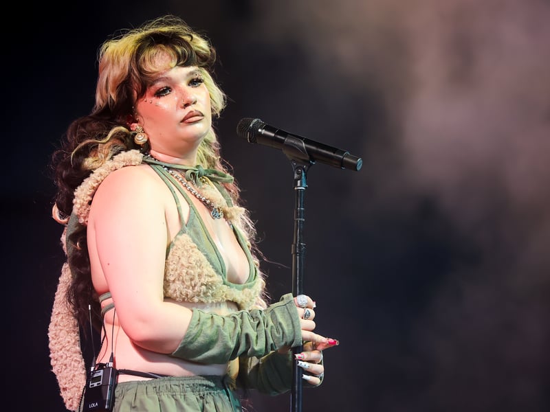 Now best recognised for her ultra-popular hit song Messy, Lola Young has been around the UK music scene for a number of years. Having attended the Brit School, Young’s cover of Together in Electric Dreams was featured in the 2021 John Lewis Christmas advert and the star herself has been active on TikTok for a number of years, particularly when promoting songs such as Don’t Hate Me, which saw her take to playgrounds with her microphone.