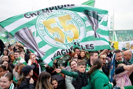 Celtic fans celebrate victory in the Premiership outside Celtic Park, Glasgow.