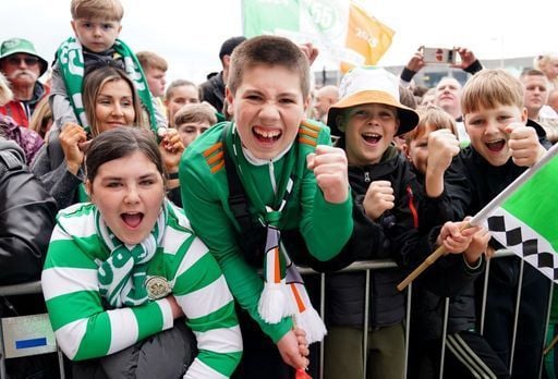 Celtic fans celebrate victory in the Premiership outside Celtic Park, Glasgow.
