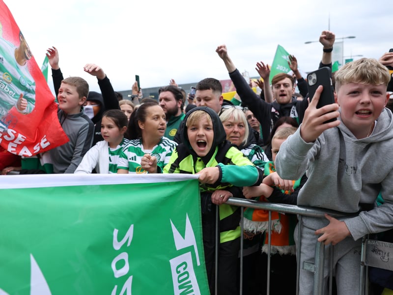 Celtic fans wait to celebrate with the team as they return from Tannadice.