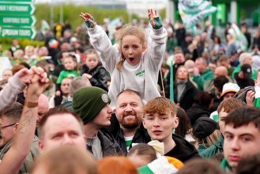Celtic fans celebrate victory in the Premiership outside Celtic Park.