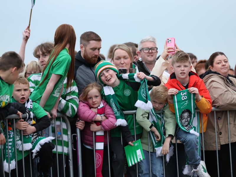 Young Celtic fans celebrate the club's fourth successive title win.