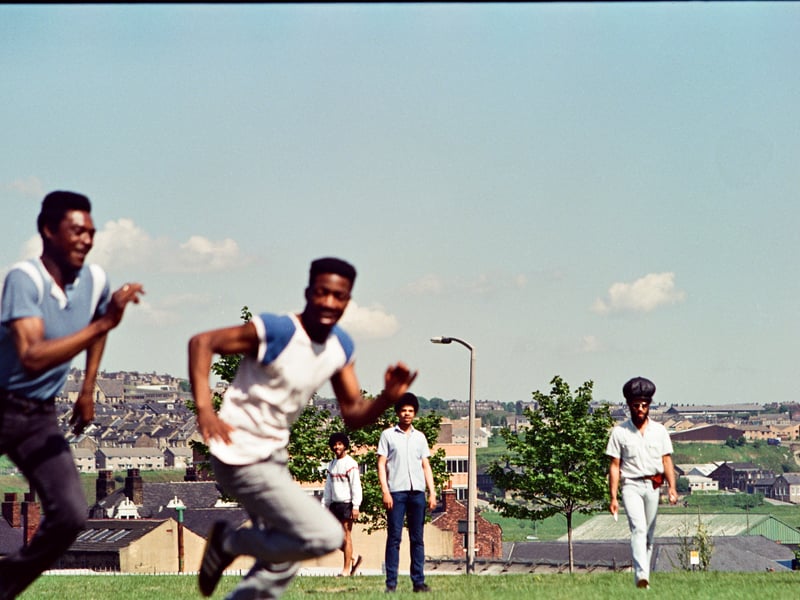 Michael White, Curly Roots, Pikey D and friends playing football on Green Lane field.