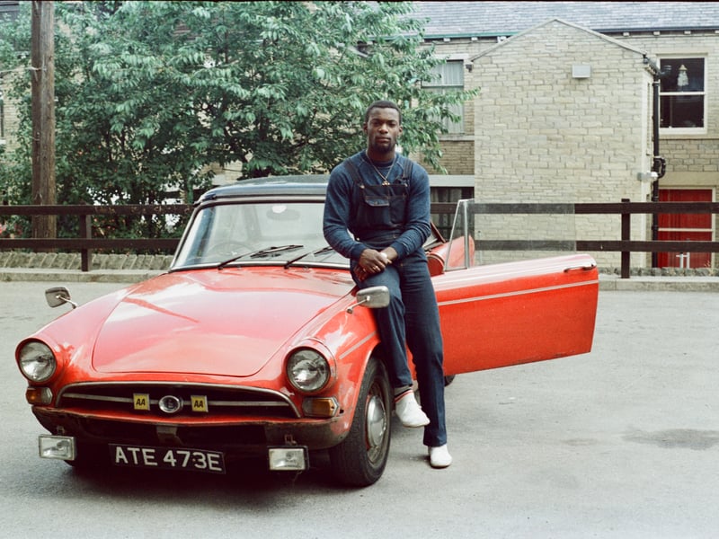 Roy Lewinson outside Cunliffe Vilas in Manningham with his beloved Sunbeam Alpine Mk 5.