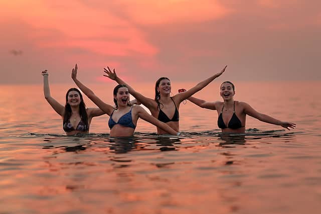 Hundreds of brave souls took part in the traditional May Day dip in St Andrews.