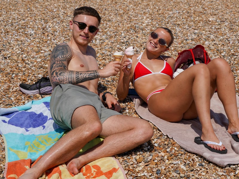 Hot weather pictures in Southsea, Portsmouth 

Pictured: Matt Ollie with Carlotte Cushion enjoying ice cream on the beach

Picture: Jack Oliver