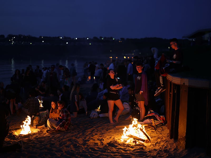 As the sun went down swimmers lit fires to keep warm.