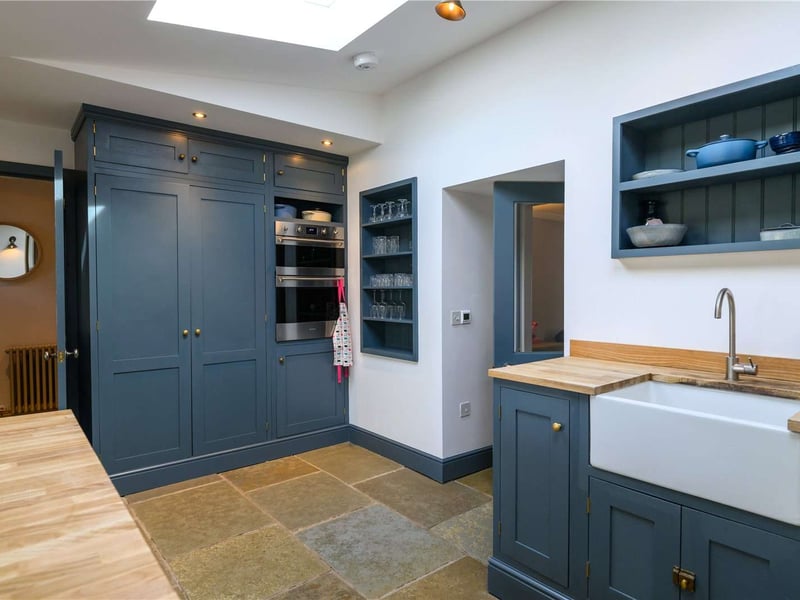 There's a built-in oven and larder space as well as a utility room.