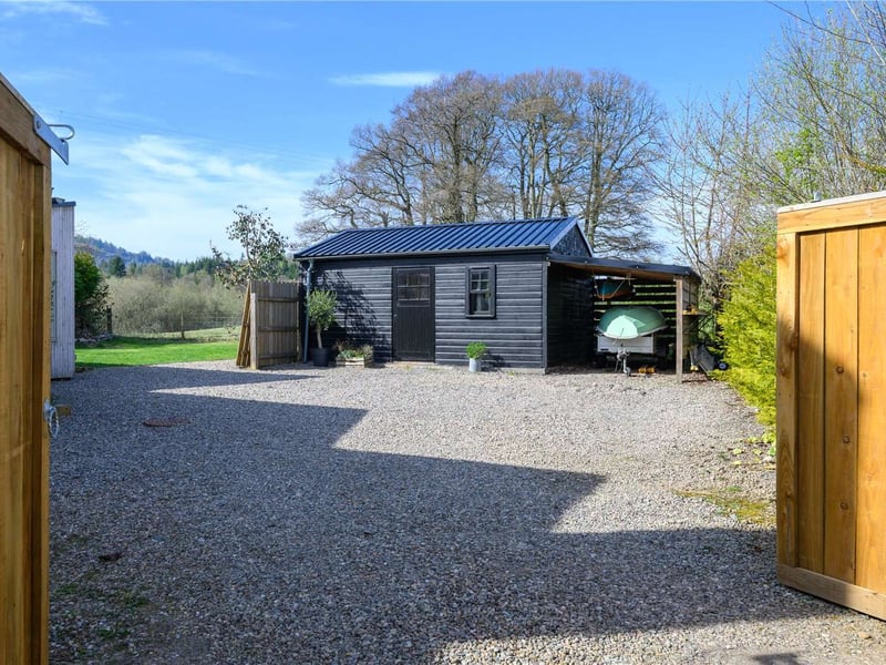 The home has a handy work shop that's being used as a boat shed.
