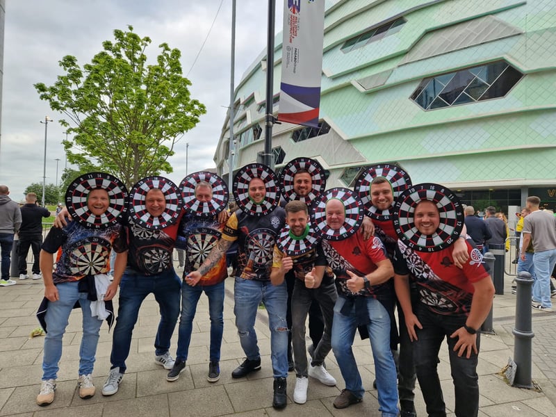 Darts fans in their dartboard masks.