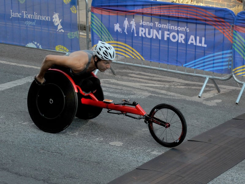 Wheelchair racer Callum Hall was cheered on by crowds packed along the route.