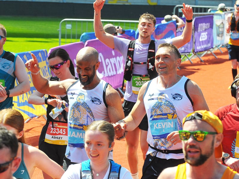 Jamie Jones-Buchanan and Kevin Sinfield reach the finish line to cheers from the crowds.