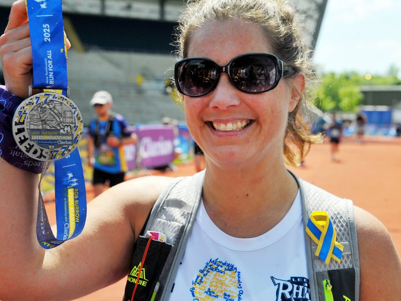 Her kids proudly presented the well-earned medal.