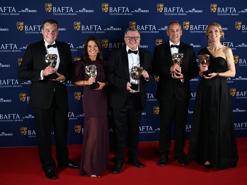 Gareth Knowles, Kelly Crawford, Richard Frediani, Liam Blyth and Caroline Turner pose with the News Coverage Award for 'BBC Breakfast: Post Office Special' inside the Winners Room at the 2025 BAFTA Television Awards