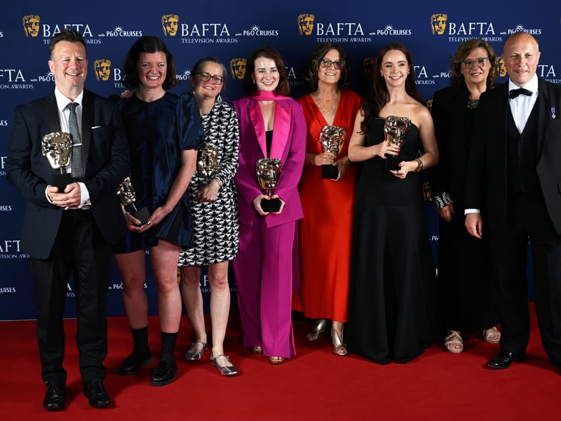 Alison Howe, Janet Fraser Crook and members of cast and crew pose with the Live Event Coverage Award for 'Glastonbury 2024' inside the Winners Room at the 2025 BAFTA Television Awards