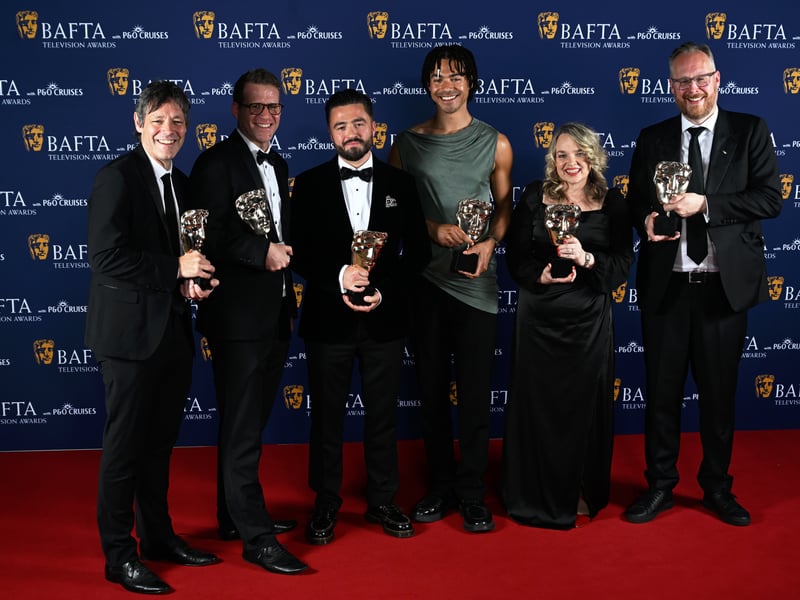 Bruce Fletcher, Peter Beard, Ashley Francis-Roy, Michael Harte and cast and crew pose with the Factual Series Award for 'To Catch a Copper' inside the Winners Room at the 2025 BAFTA Television Awards.