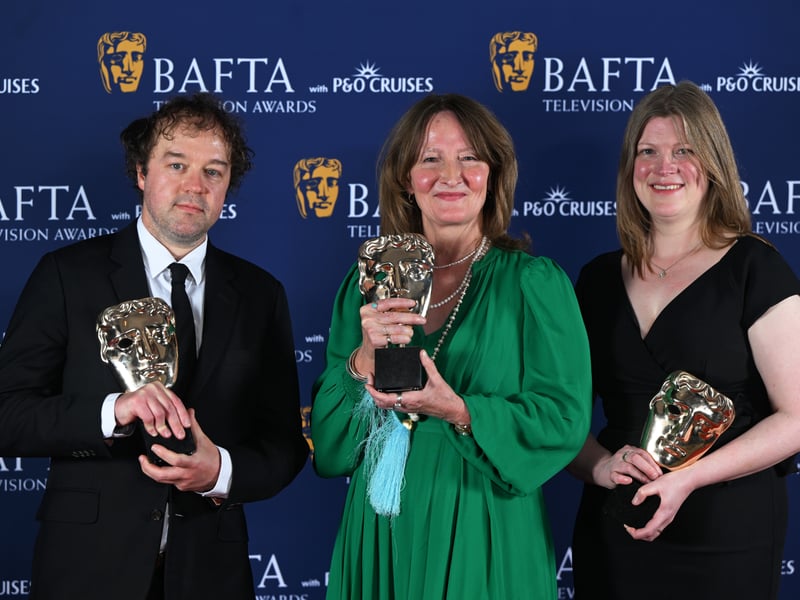 Jamie Roberts, Kate Spankie and Clare Walker pose with the Single Documentary Award for 'Ukraine: Enemy in the Woods' inside the Winners Room at the 2025 BAFTA Television Awards.