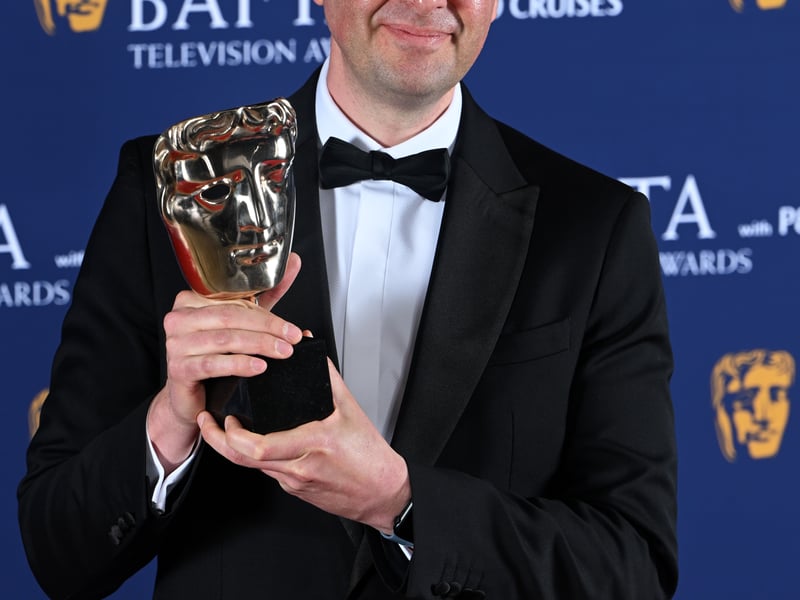 Matt Peacock poses with the Children's: Non-Scripted Award for 'Disability and Me (FYI Investigates)' inside the Winners Room at the 2025 BAFTA Television Awards