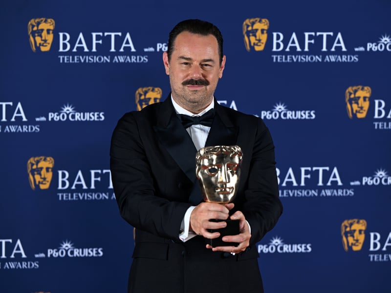 Danny Dyer poses with the Male Performance in a Comedy Programme Award for 'Mr Bigstuff' inside the Winners Room at the 2025 BAFTA Television Awards