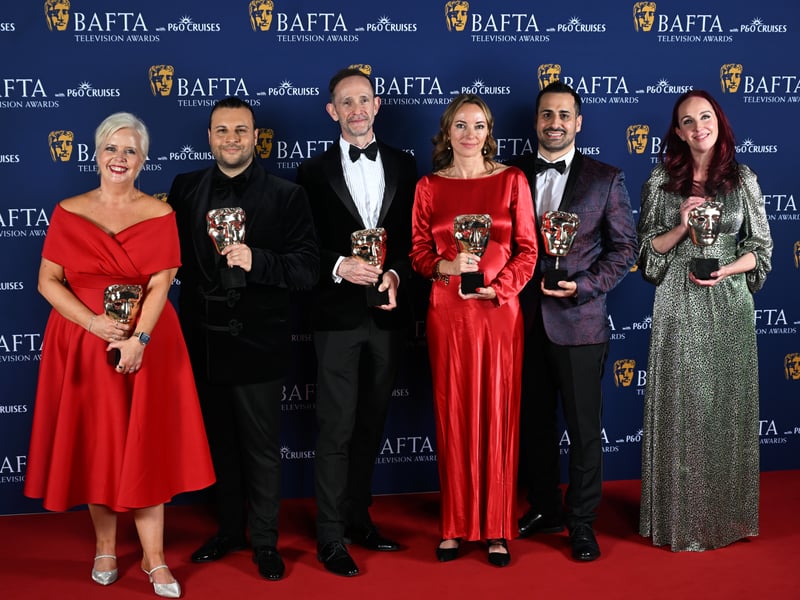 Sharon Batten, Chris Clenshaw, Kieran Grimes, Lauren Klee, Kyri Zindilis and Joanna Thompson pose with the Soap Award for 'Eastenders' inside the Winners Room at the 2025 BAFTA Television Awards.